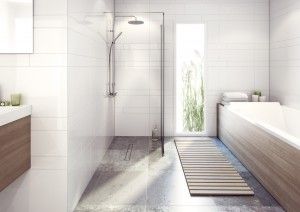 The Purusline Living Linear Wetroom Drain installed into a wetroom with a Tile Insert Grate