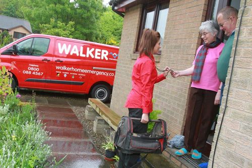 Walker home emergency plumber with customer