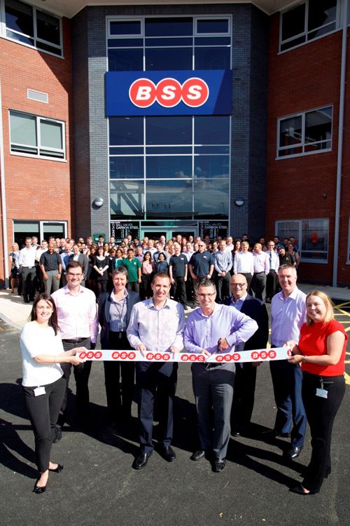 BSS managing director Chris Hufflett (centre left) and Travis Perkins, contract merchanting division, CEO Frank Elkins (centre right) cutting the ribbon on new HQ Boss Court.