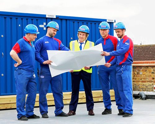 (From left to right) Craig Bly, Marcis Kravalis, Charlie Mullins, Perry Hovey and James Webb on the roof of Pimlico House, which will soon feature an additional storey