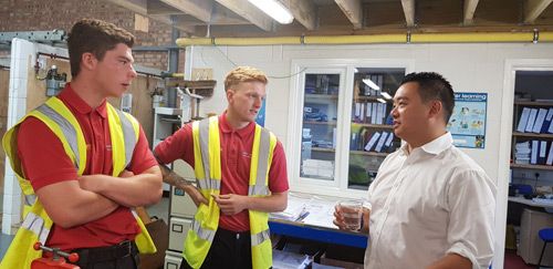 Aura Gas apprentices Billy Simmonds and Frankie Small chatting to Alan Mak MP